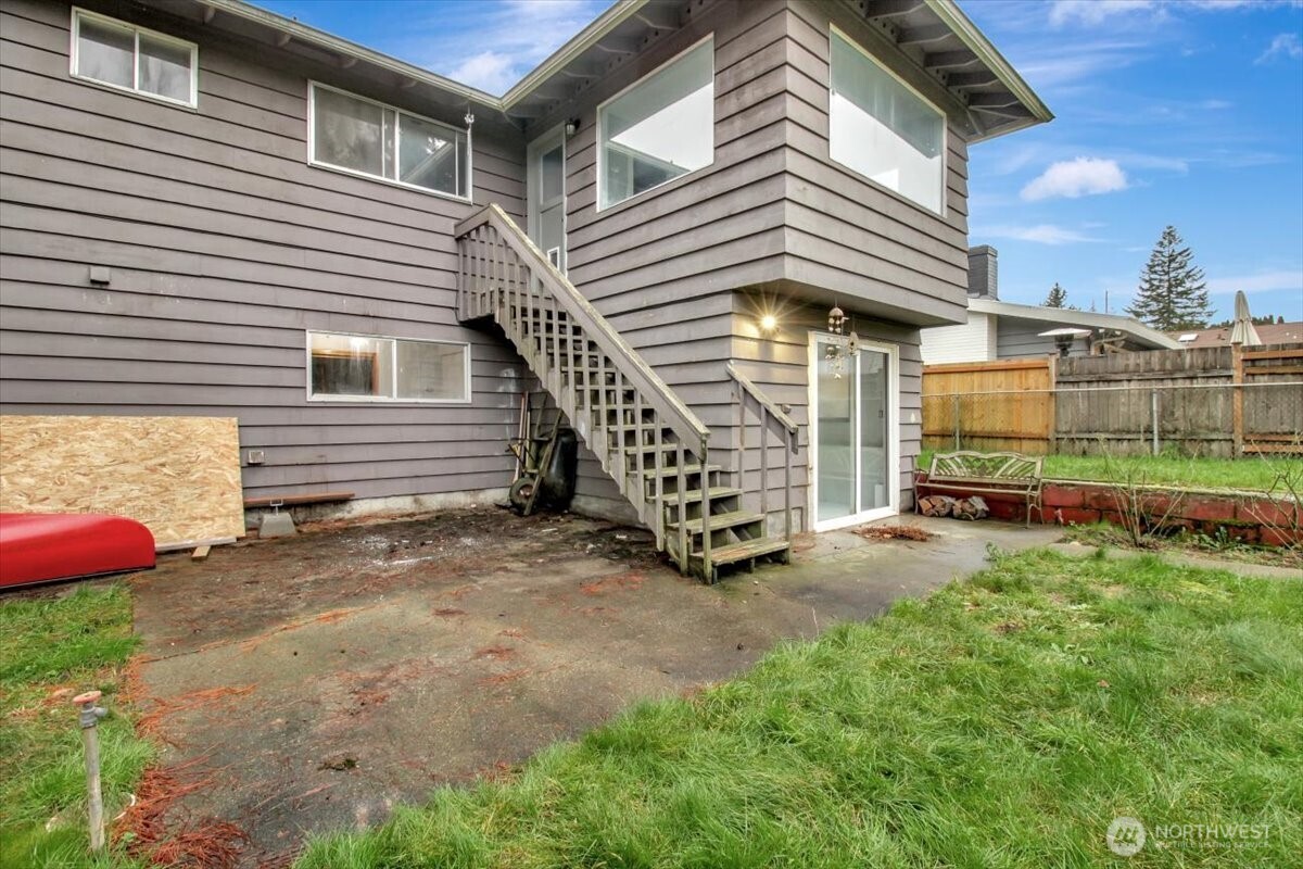 7313 228th Street Southwest Mountlake Terrace, WA 98043 - Photo 33 of 34 a view of a house with a yard