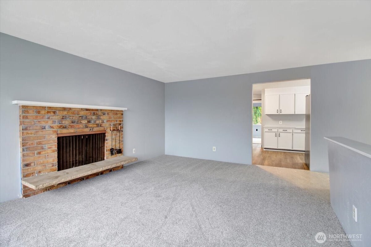 7313 228th Street Southwest Mountlake Terrace, WA 98043 - Photo 4 of 34 a view of empty room with a fireplace