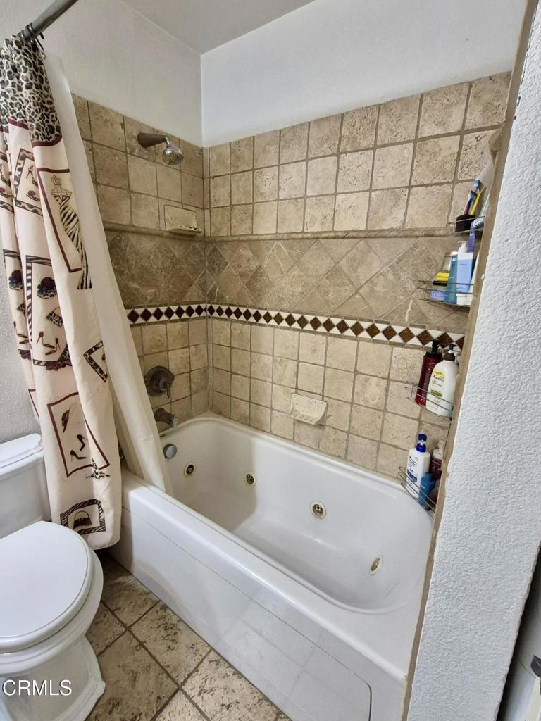 312 West Santa Barbara Street Santa Paula, CA 93060 - Photo 18 of 22 a bathroom with a bathtub and a shower
