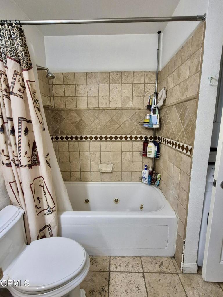 312 West Santa Barbara Street Santa Paula, CA 93060 - Photo 19 of 22 a bathroom with a bathtub and shower