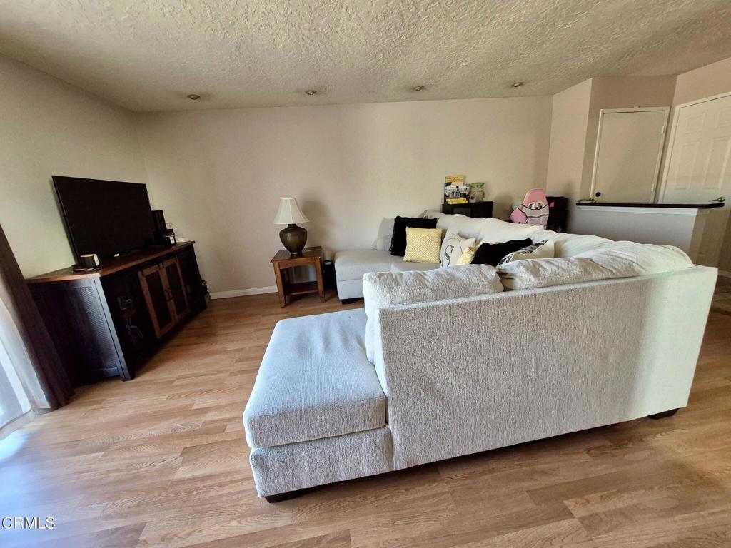 312 West Santa Barbara Street Santa Paula, CA 93060 - Photo 4 of 22 a living room with furniture and a flat screen tv