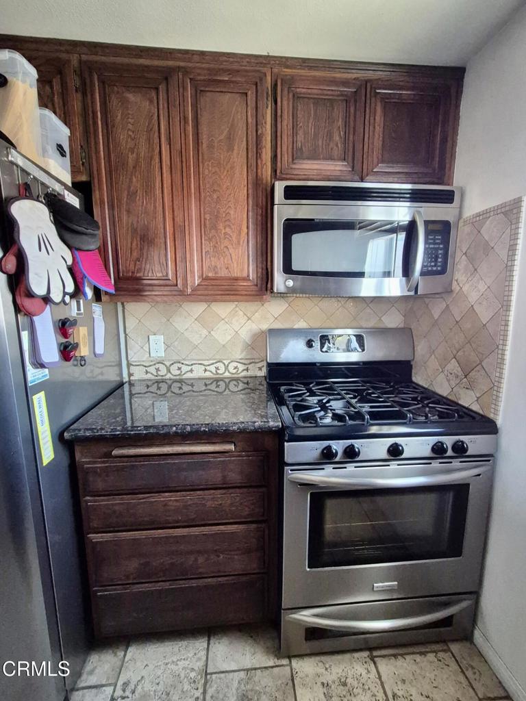 312 West Santa Barbara Street Santa Paula, CA 93060 - Photo 9 of 22 a stove top oven sitting inside of a kitchen