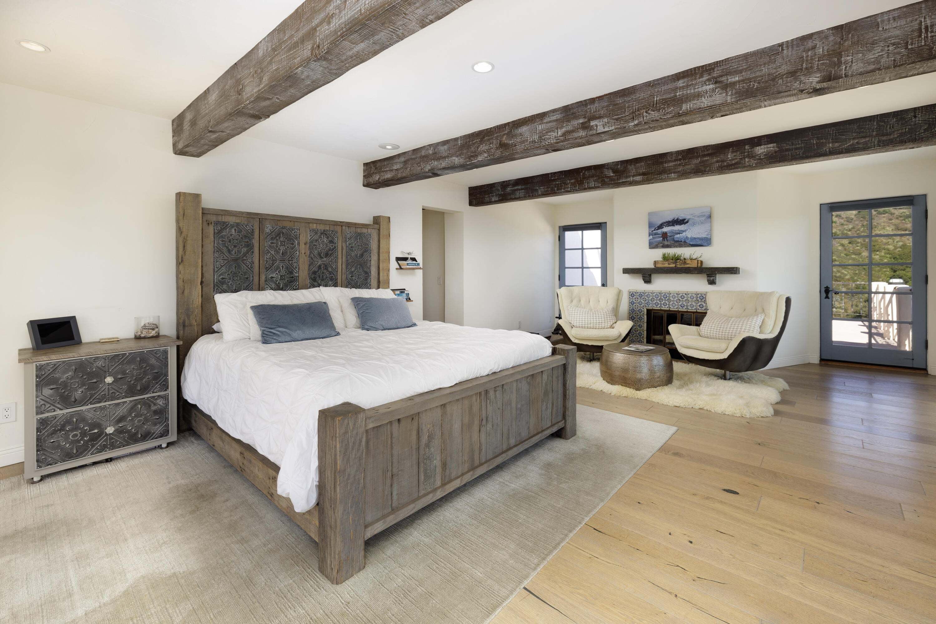 1230 Northridge Road Santa Barbara, CA 93105 - Photo 15 of 36 a bedroom with a large bed and wooden floor