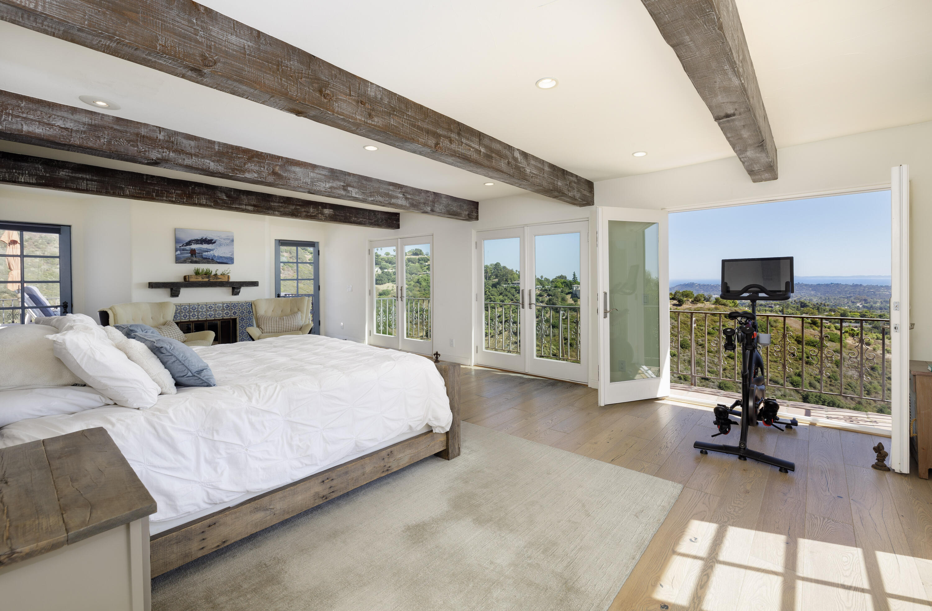 1230 Northridge Road Santa Barbara, CA 93105 - Photo 15 of 36 a bedroom with furniture and a flat screen tv