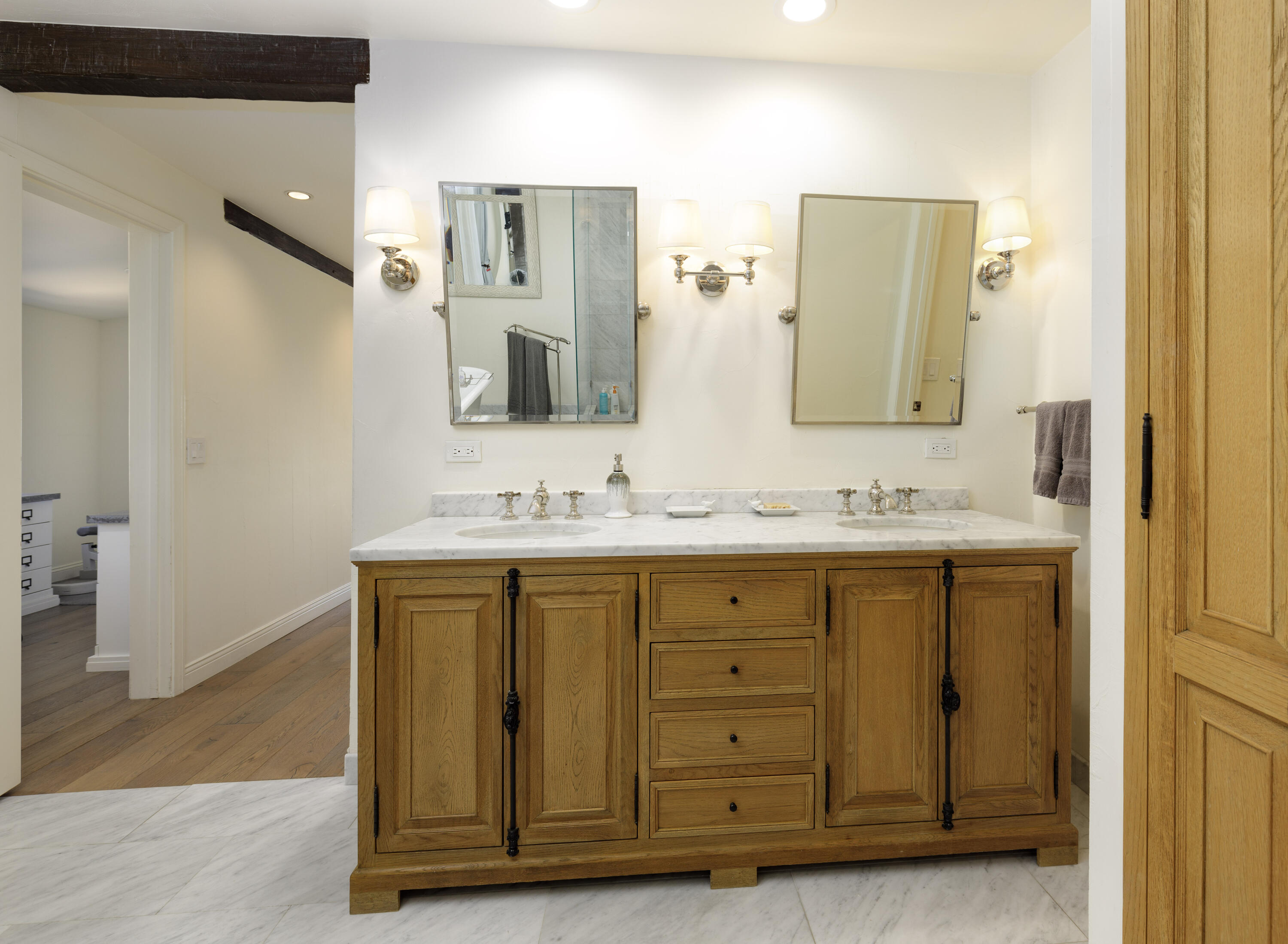 1230 Northridge Road Santa Barbara, CA 93105 - Photo 18 of 36 a bathroom with a granite countertop sink and a mirror