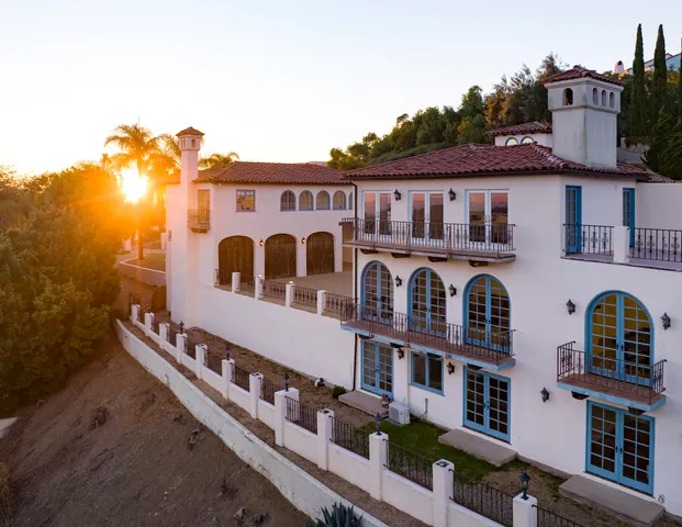 a view of a large building with a mountain