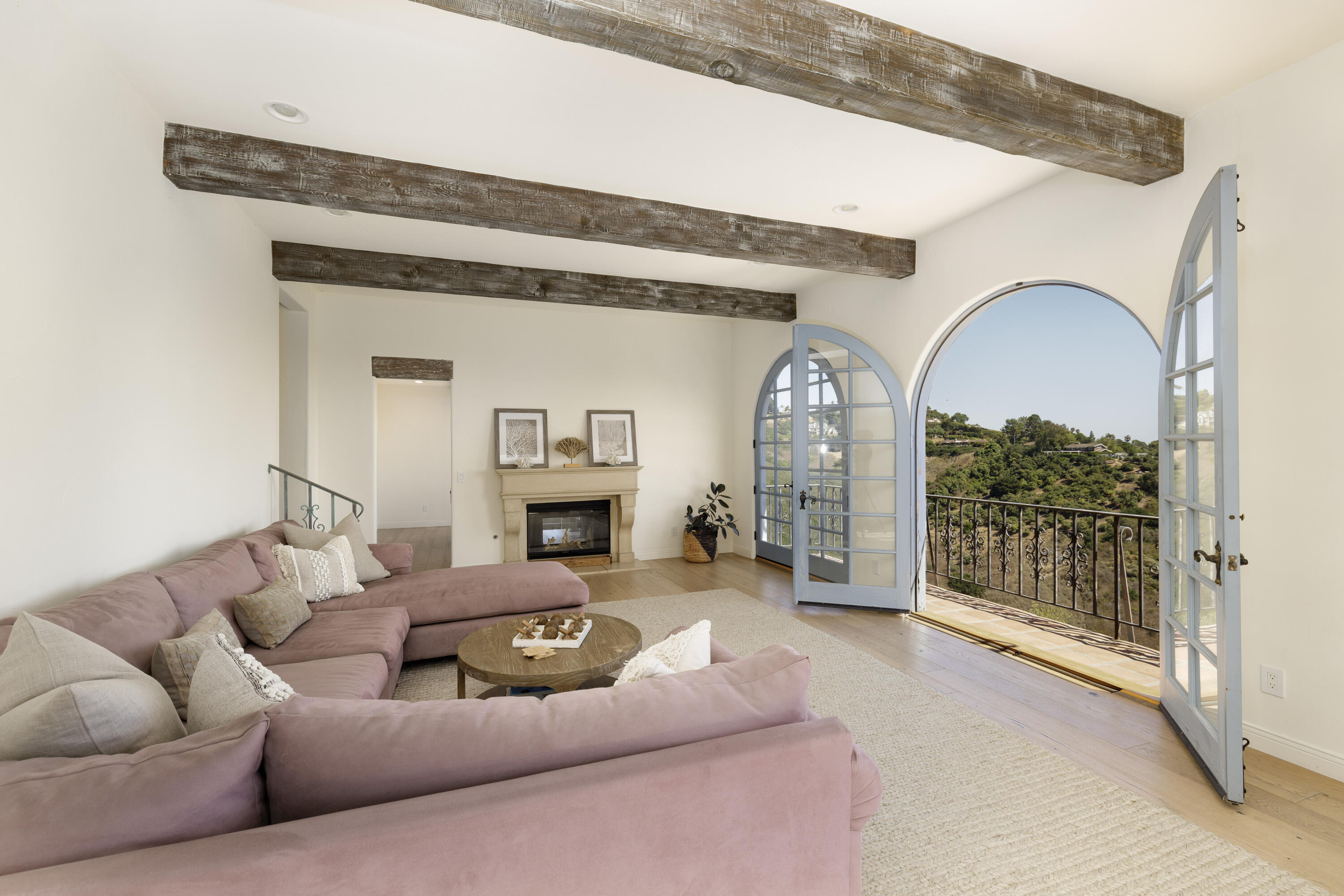 1230 Northridge Road Santa Barbara, CA 93105 - Photo 7 of 36 a living room with furniture a fireplace and a floor to ceiling window