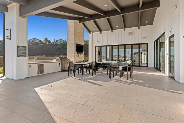 a patio with a table and chairs