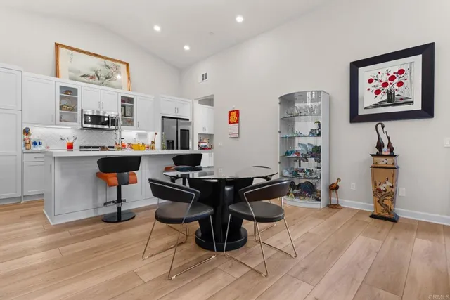 a workspace with furniture and a wooden floor