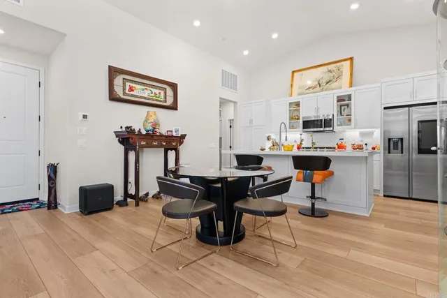 a work room with furniture and a chandelier