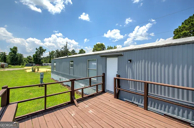 a view of a terrace with wooden floor and outdoor space