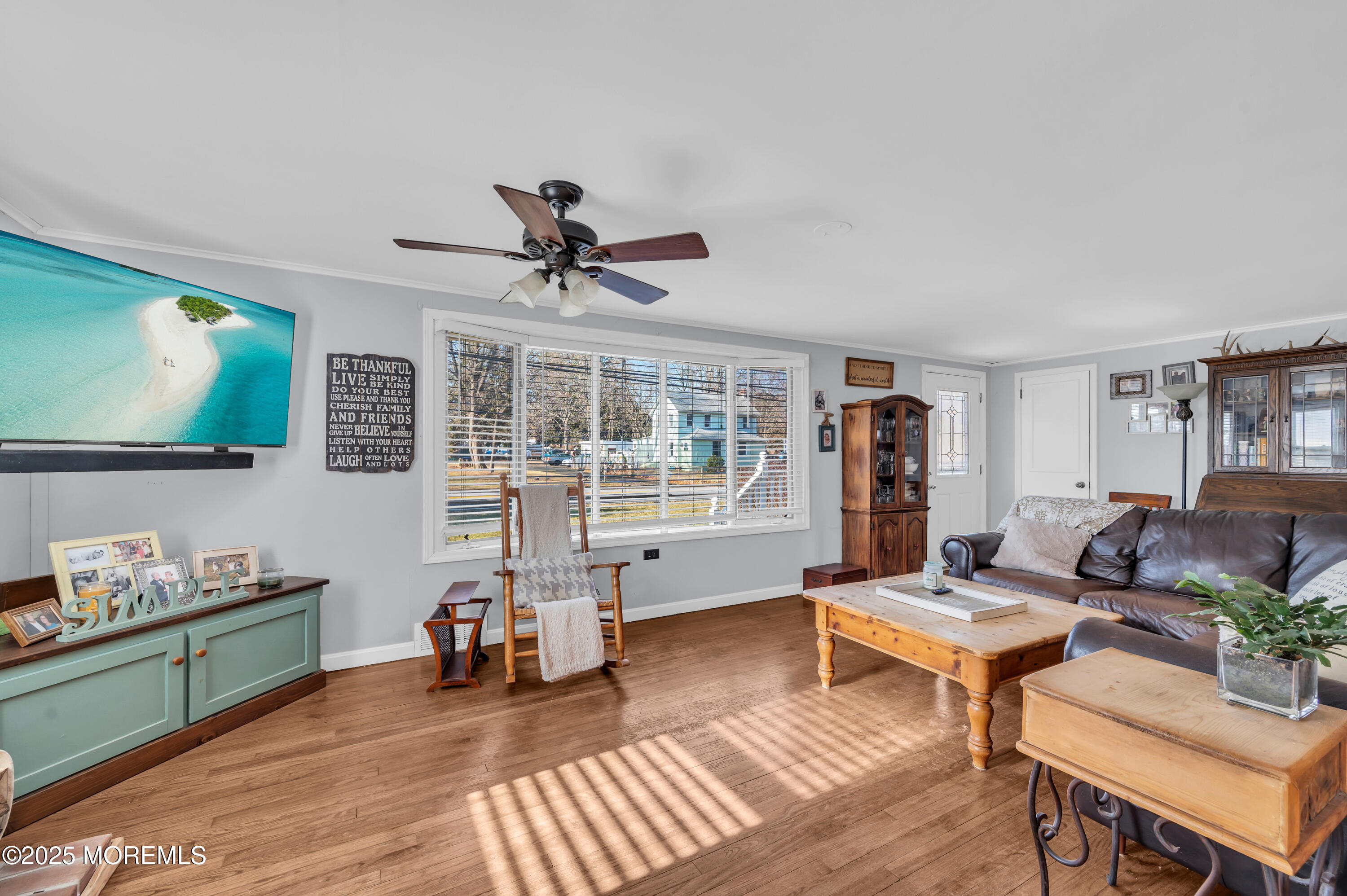 1830 New Bedford Road Wall, NJ 07719 - Photo 16 of 65 a living room with furniture and a flat screen tv with wooden floor