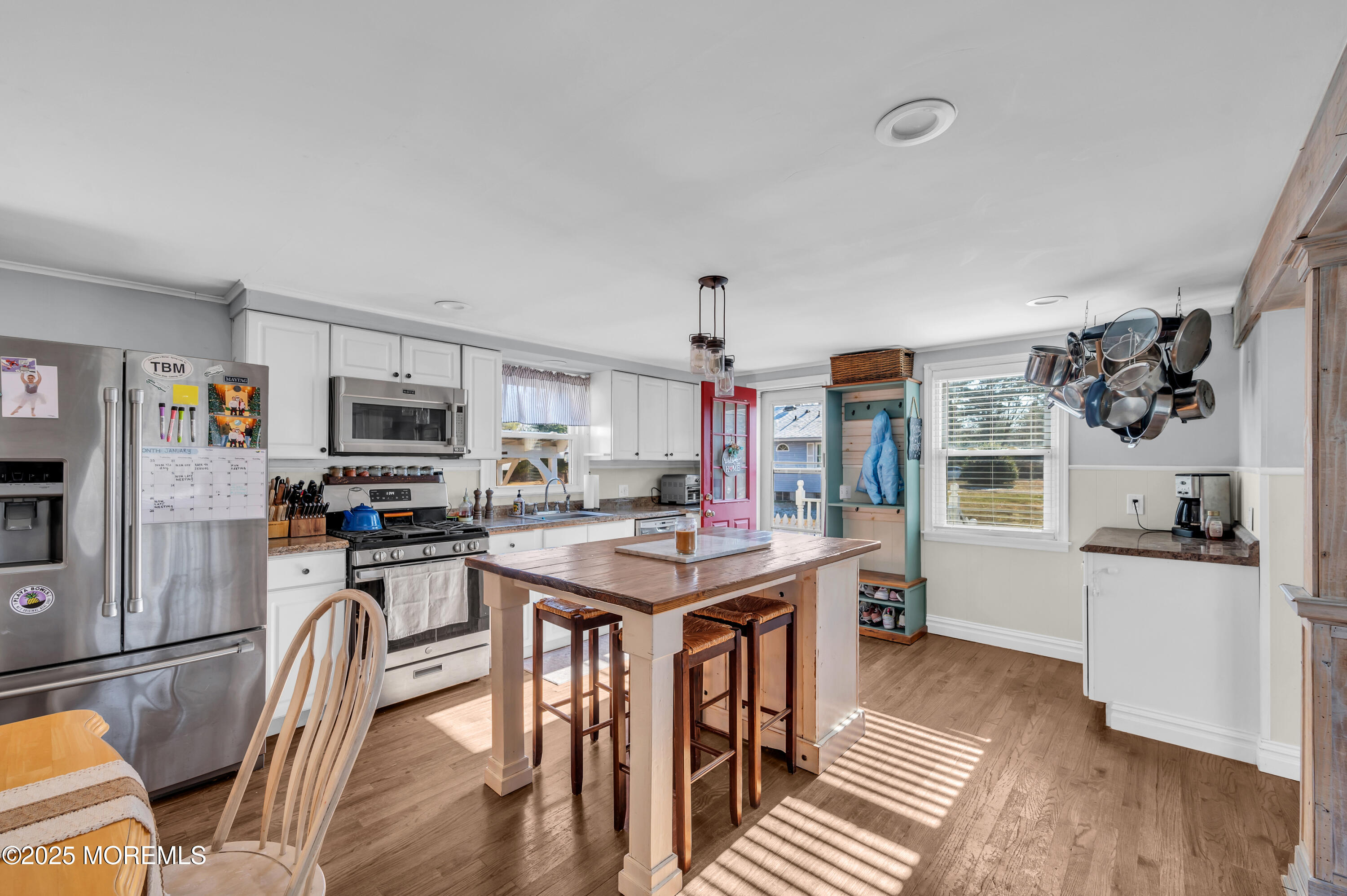 1830 New Bedford Road Wall, NJ 07719 - Photo 18 of 65 a kitchen with stainless steel appliances granite countertop a stove top oven a sink dishwasher and cabinets with wooden floor