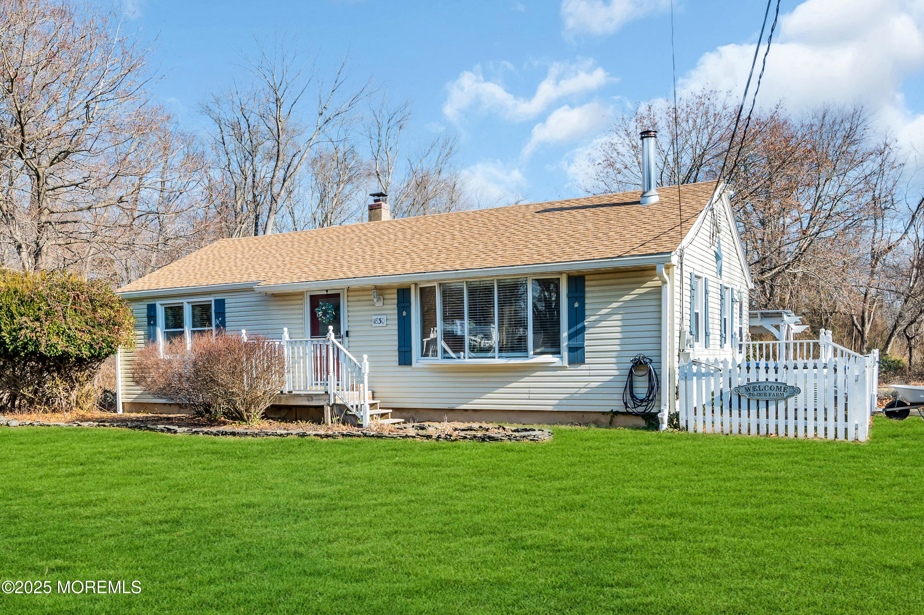 1830 New Bedford Road Wall, NJ 07719 - Photo 2 of 65 a front view of a house with a garden and yard