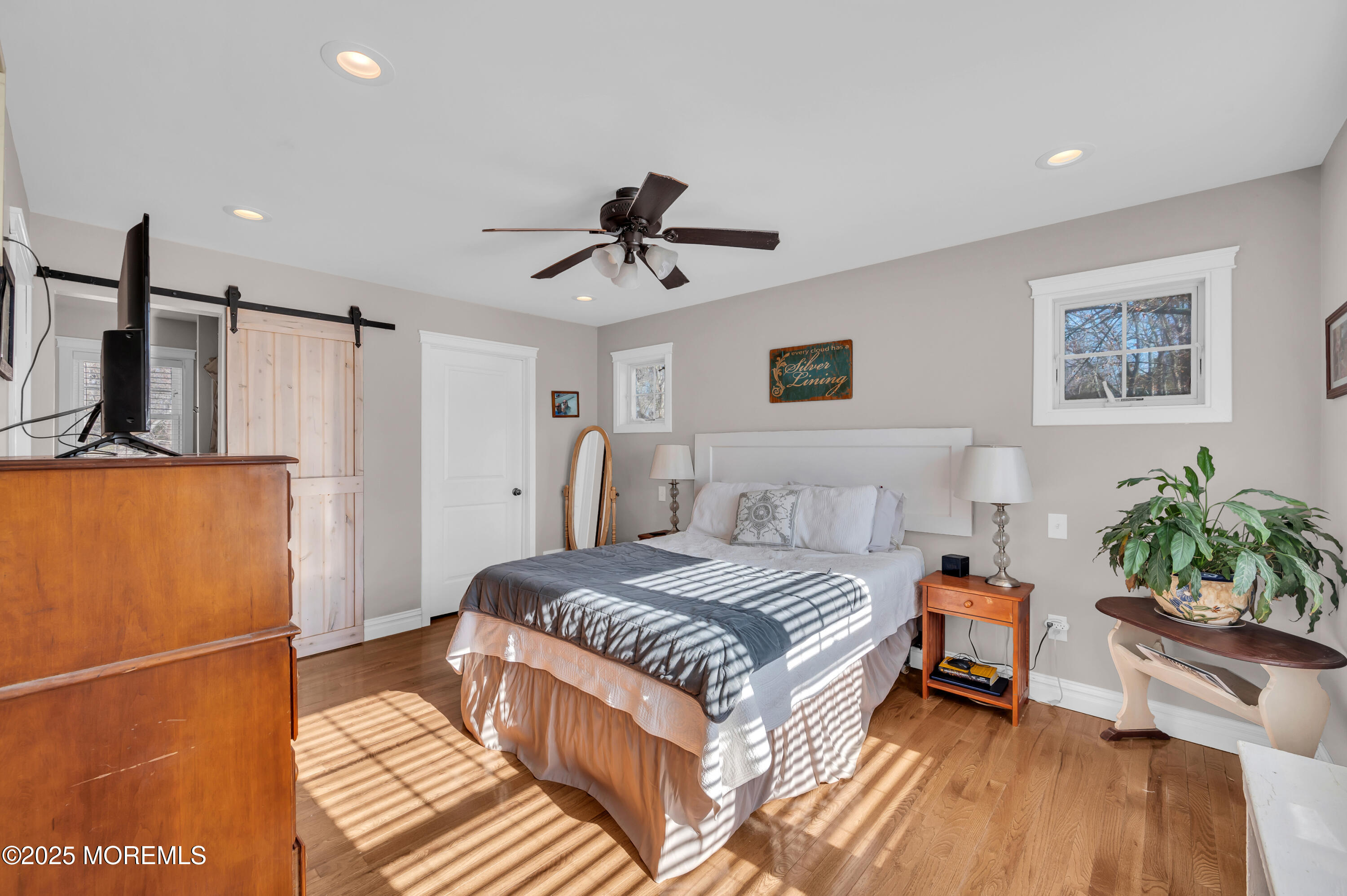 1830 New Bedford Road Wall, NJ 07719 - Photo 26 of 65 a bedroom with a bed a couch and a potted plant on the dresser