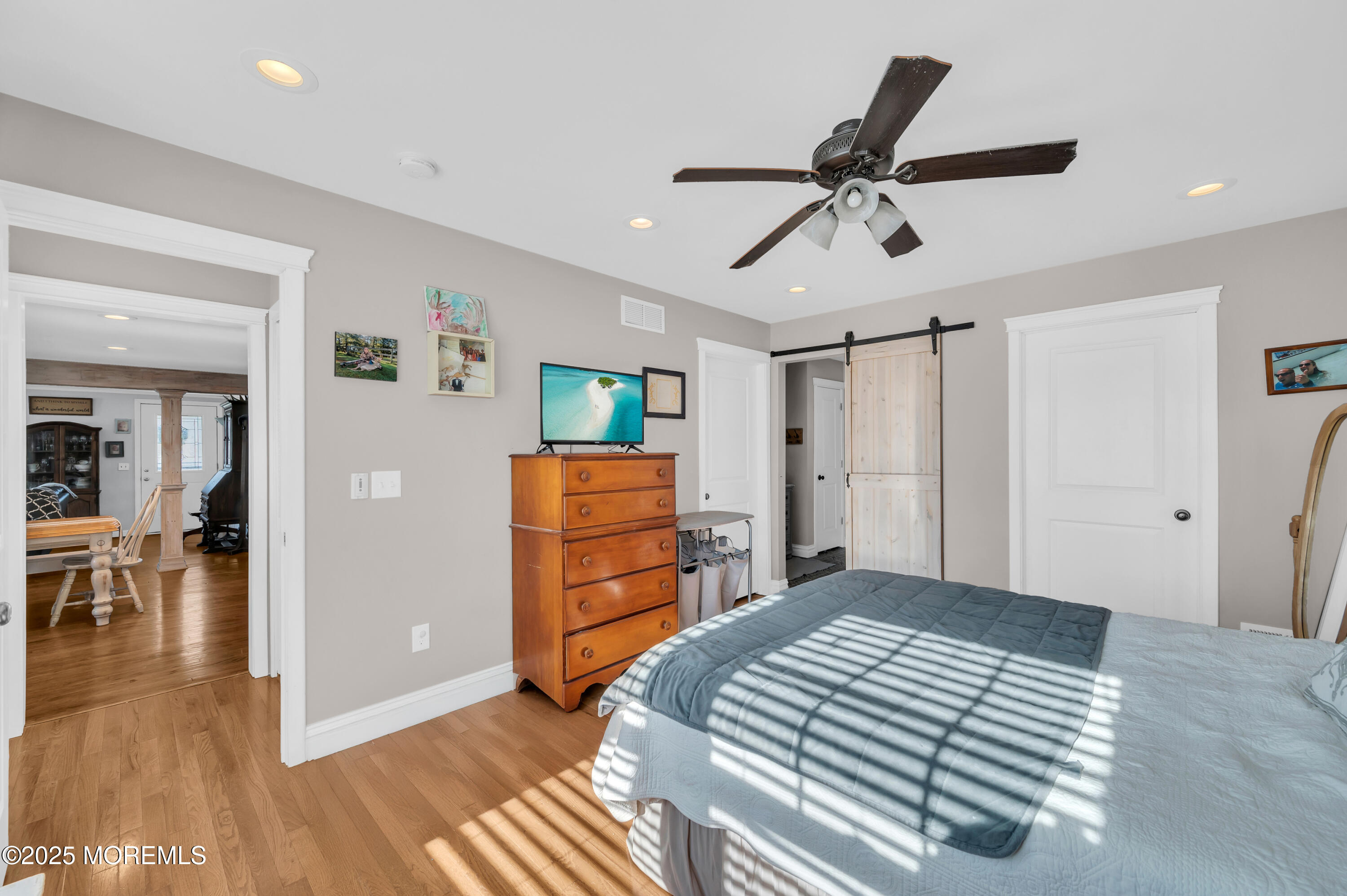 1830 New Bedford Road Wall, NJ 07719 - Photo 27 of 65 a bedroom with a bed and a chandelier