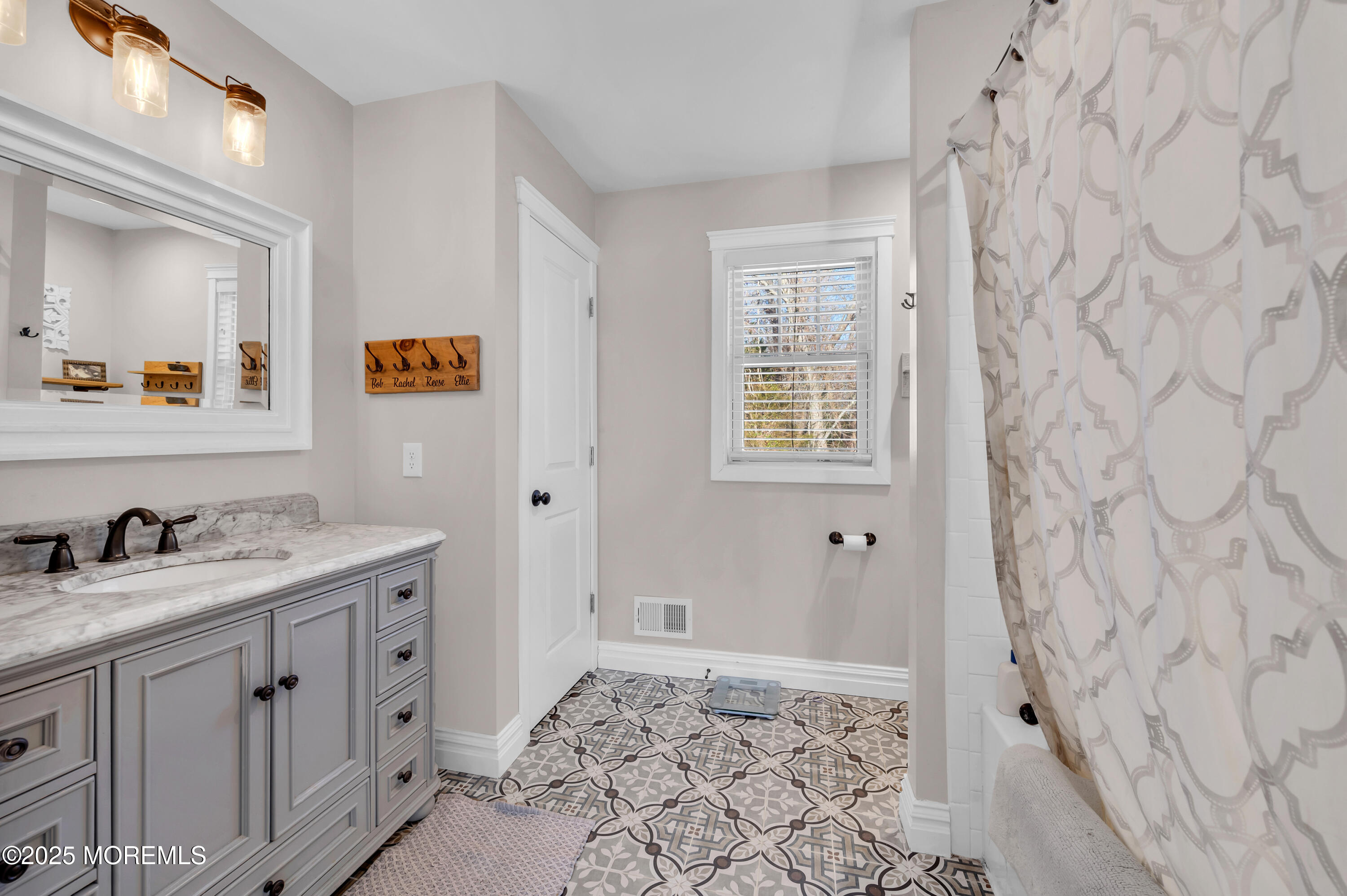1830 New Bedford Road Wall, NJ 07719 - Photo 28 of 65 a bathroom with a sink and a mirror