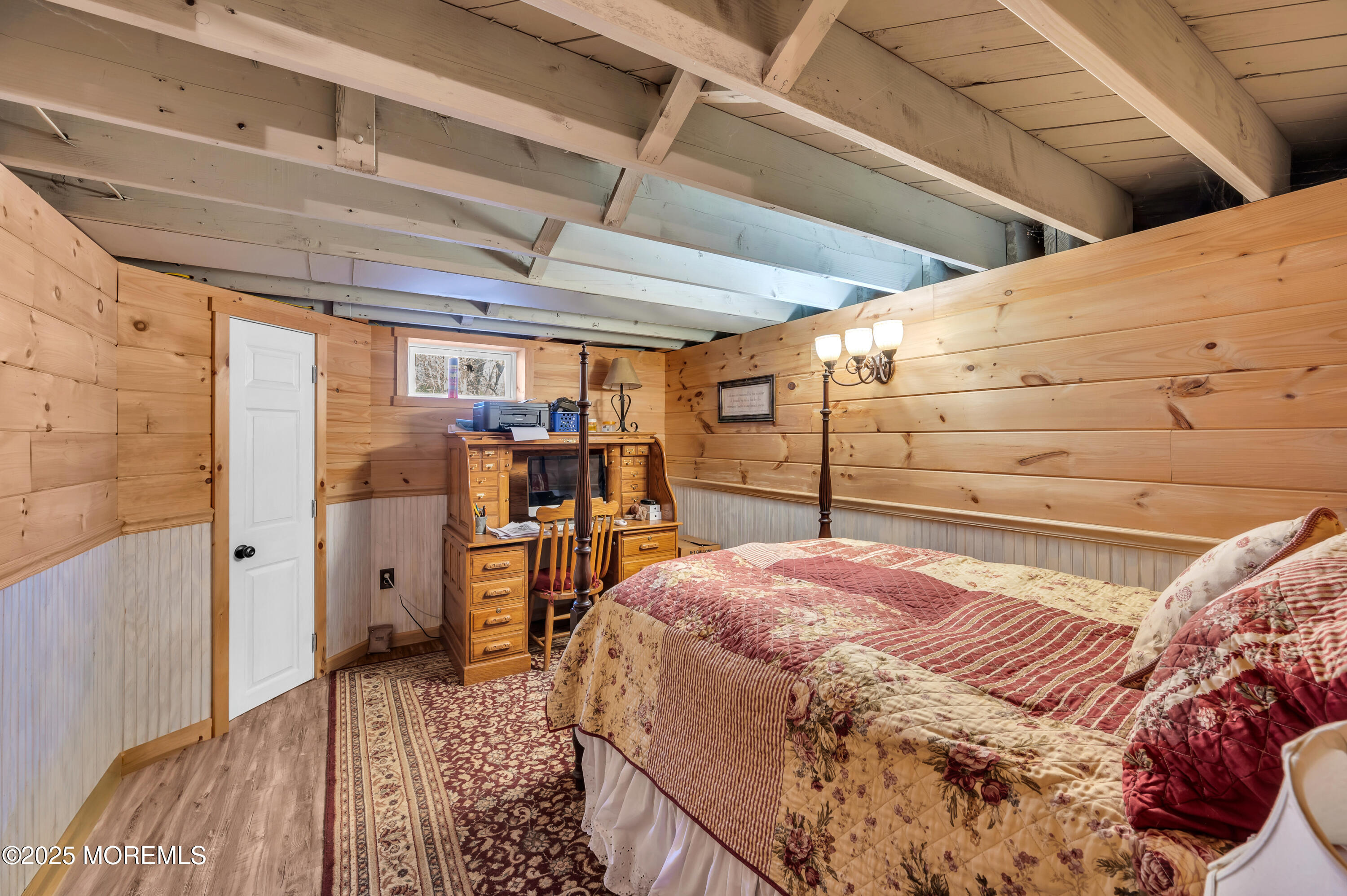 1830 New Bedford Road Wall, NJ 07719 - Photo 40 of 65 a bed room with a bed and wooden floors