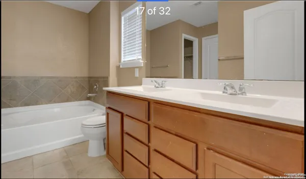 a bathroom with a sink a toilet and bathtub
