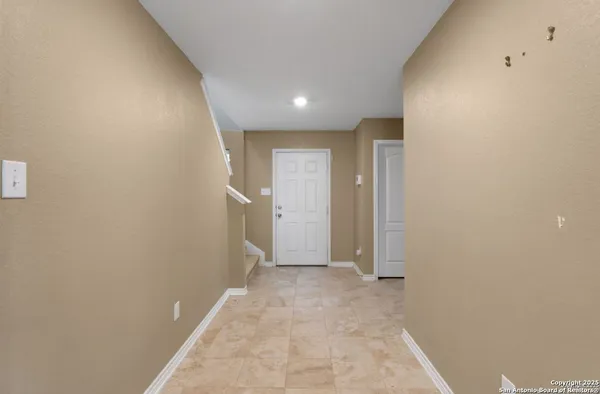 a view of hallway with an empty space