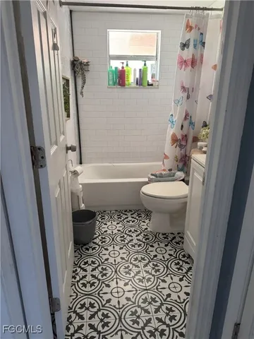 a bathroom with a toilet a sink and a bathtub