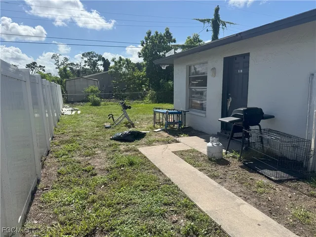a view of a backyard with sitting area