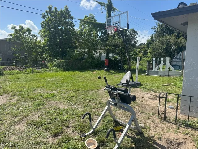 a view of a backyard with sitting area