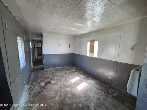 a view of an empty room and window