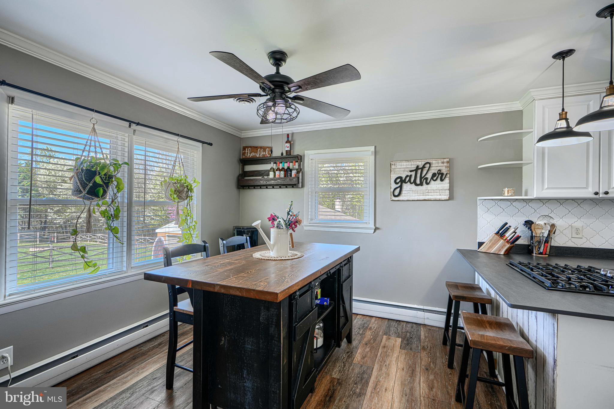 1314 East Churchville Road Bel Air, MD 21014 - Photo 13 of 48 a kitchen with a table chairs refrigerator and window