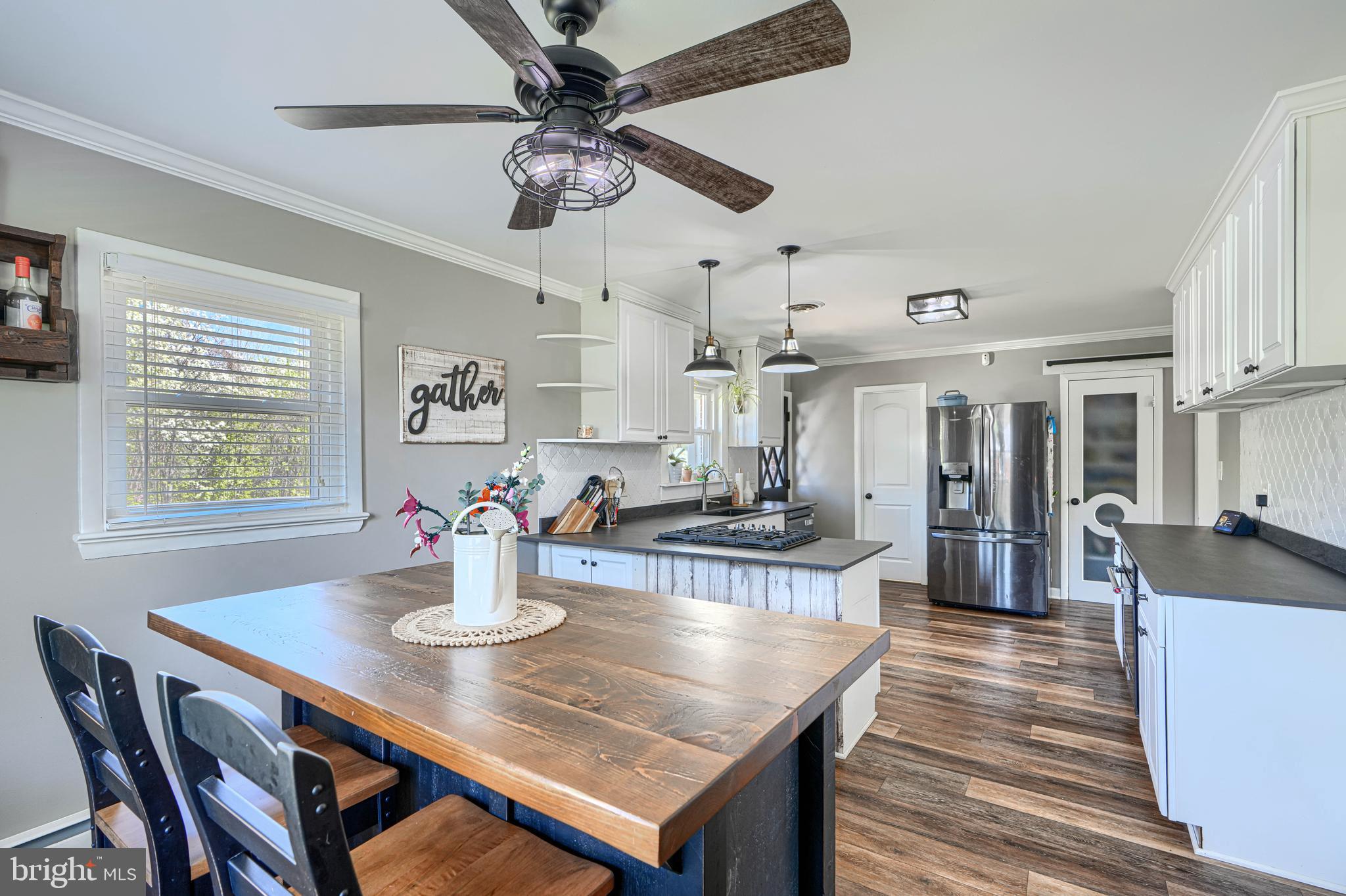 1314 East Churchville Road Bel Air, MD 21014 - Photo 14 of 48 a dining room with wooden floor and chandelier