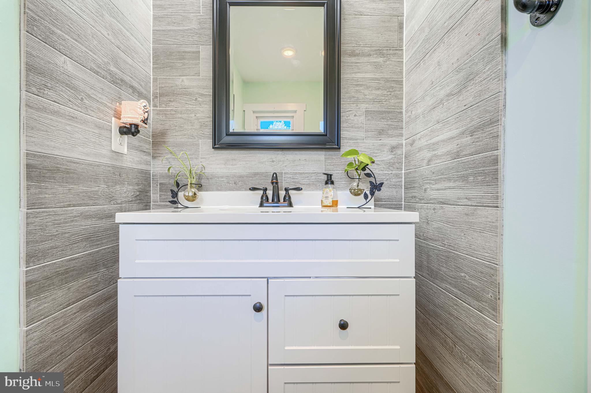 1314 East Churchville Road Bel Air, MD 21014 - Photo 19 of 48 a bathroom with a sink and a mirror