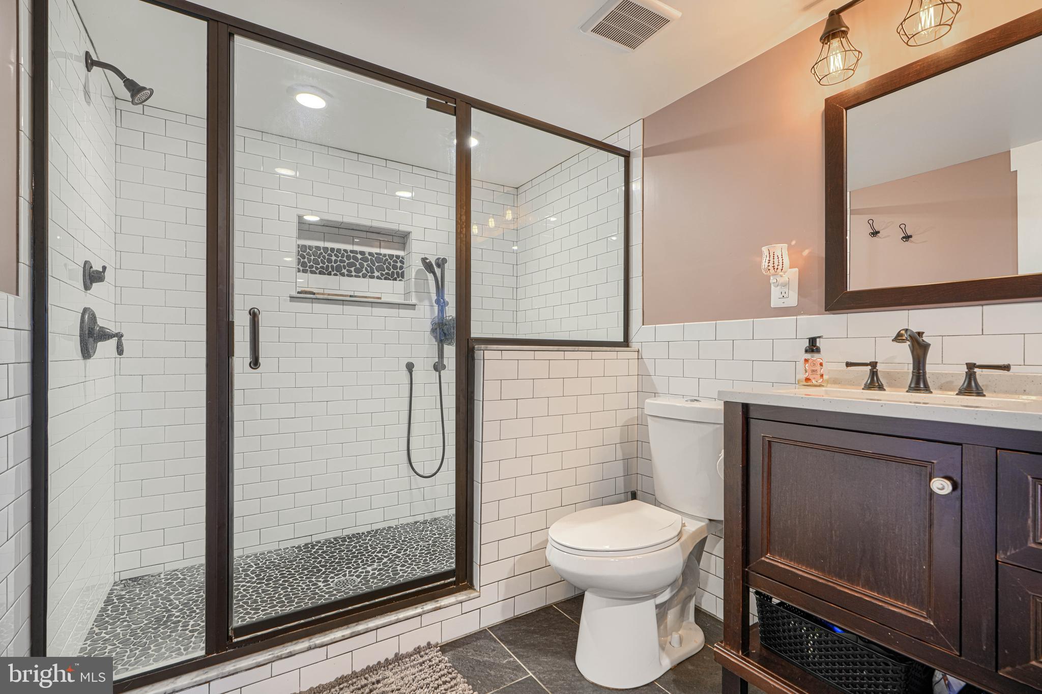1314 East Churchville Road Bel Air, MD 21014 - Photo 27 of 48 a bathroom with a toilet sink and a shower