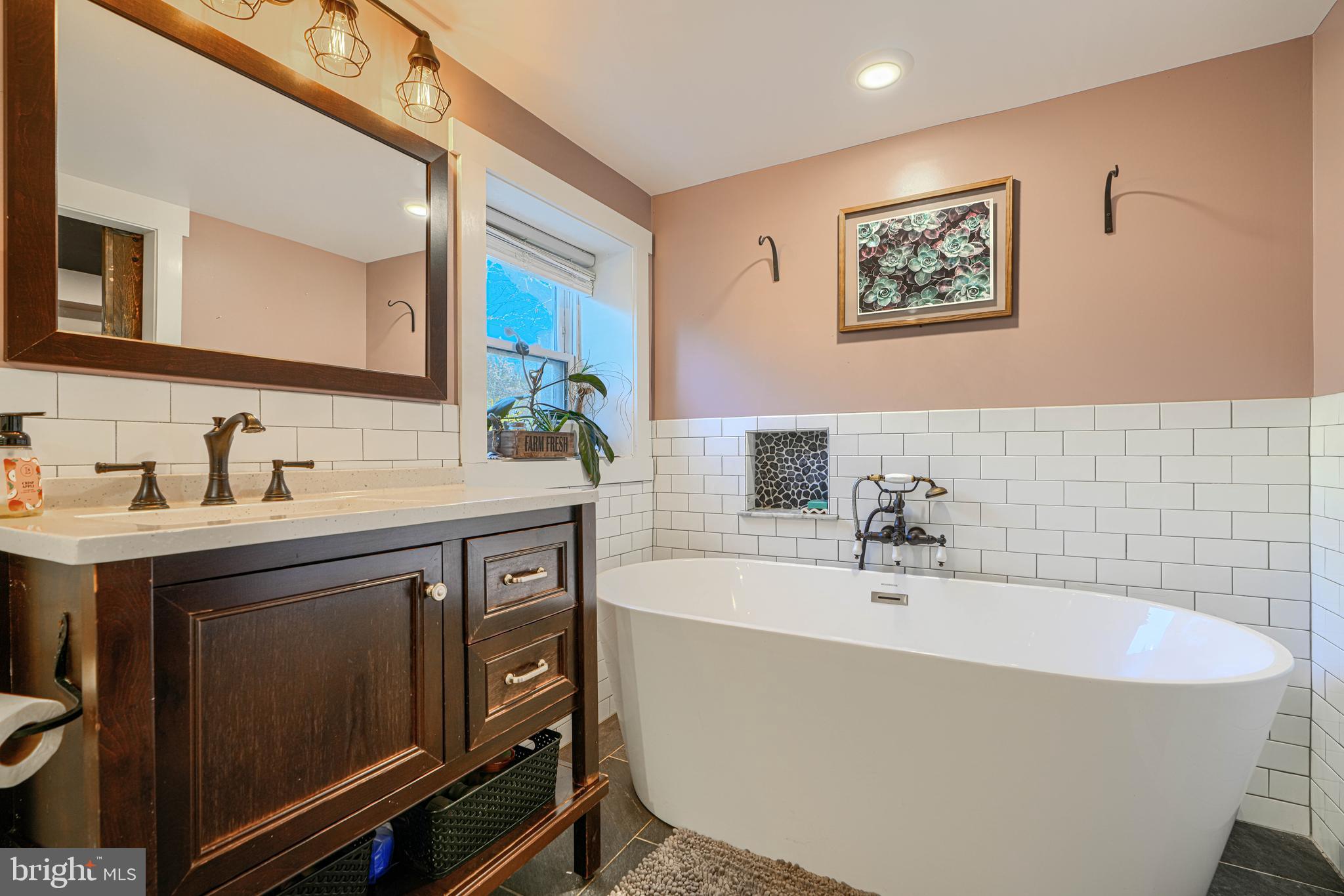 1314 East Churchville Road Bel Air, MD 21014 - Photo 28 of 48 a bathroom with a bathtub a sink and mirror