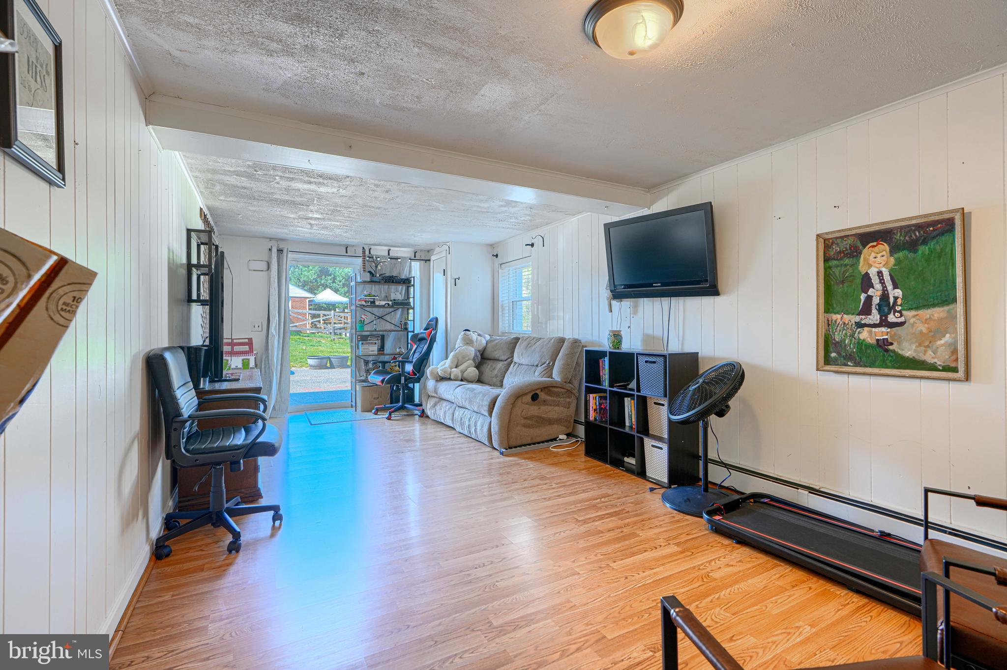 1314 East Churchville Road Bel Air, MD 21014 - Photo 35 of 48 a living room with furniture and a flat screen tv