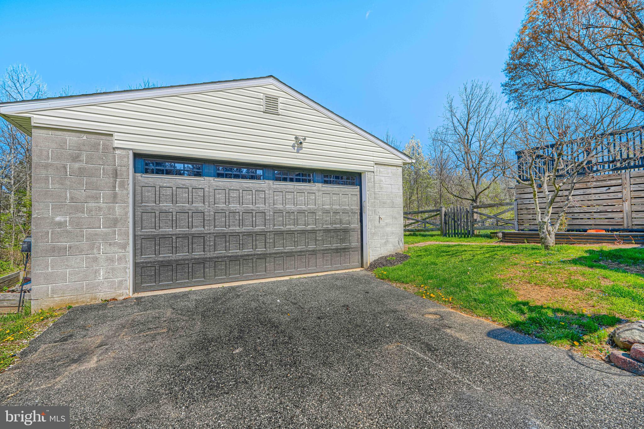 1314 East Churchville Road Bel Air, MD 21014 - Photo 48 of 48 a front view of a house with a yard and garage
