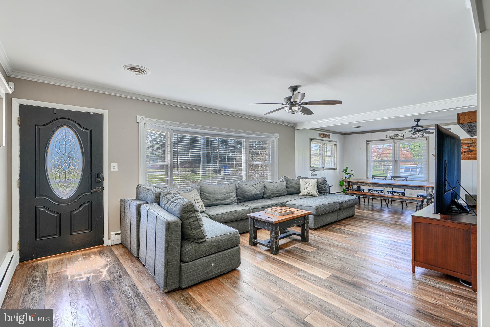 1314 East Churchville Road Bel Air, MD 21014 - Photo 5 of 48 a living room with furniture a fireplace and a flat screen tv