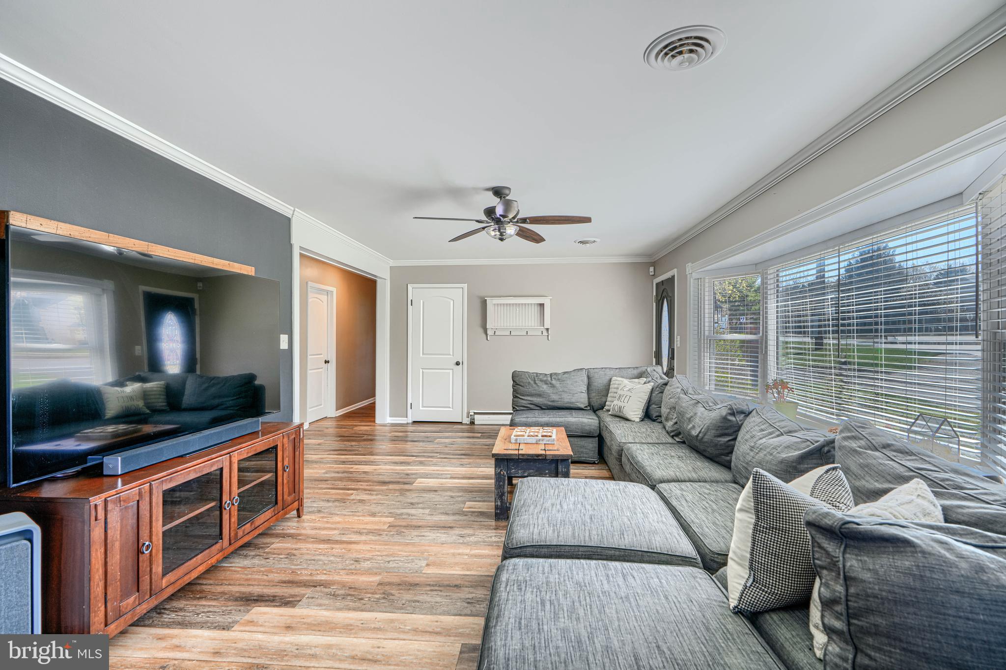 1314 East Churchville Road Bel Air, MD 21014 - Photo 8 of 48 a living room with furniture and a flat screen tv