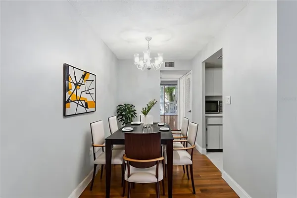 a dining room with furniture and window