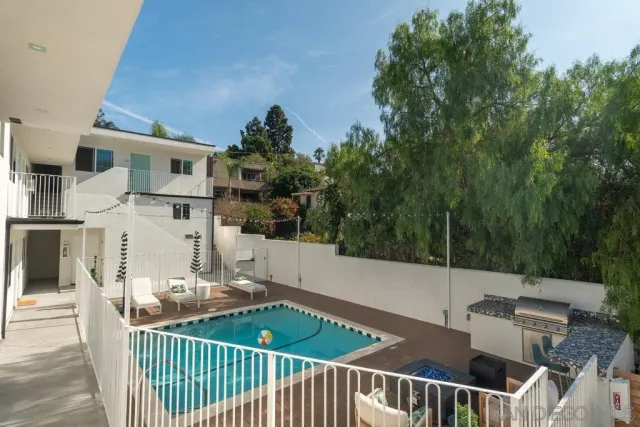 a table and chairs sitting in front of a house