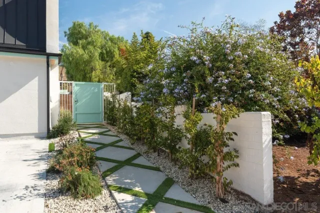 a backyard of a house with lots of green space