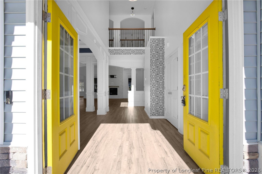 2145 Harrington Road Fayetteville, NC 28306 - Photo 6 of 50 a view of a hallway with wooden floor and staircase