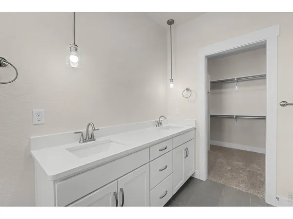 a bathroom with a sink double vanity and a mirror