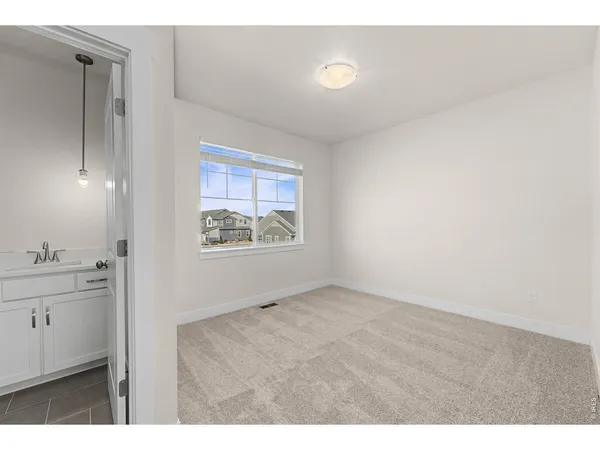 a view of an empty room and window