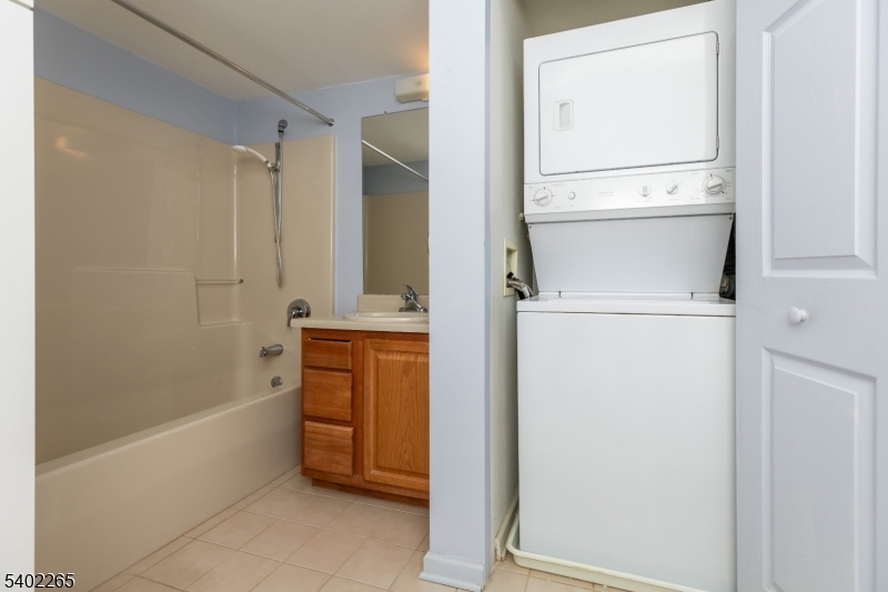 2201 Franklin Lane, Unit 2201 Rockaway, NJ 07866 - Photo 12 of 31 a bathroom with a tub sink and mirror