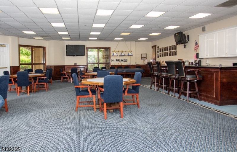 2201 Franklin Lane, Unit 2201 Rockaway, NJ 07866 - Photo 23 of 31 a view of a dining area with furniture window and wooden floor