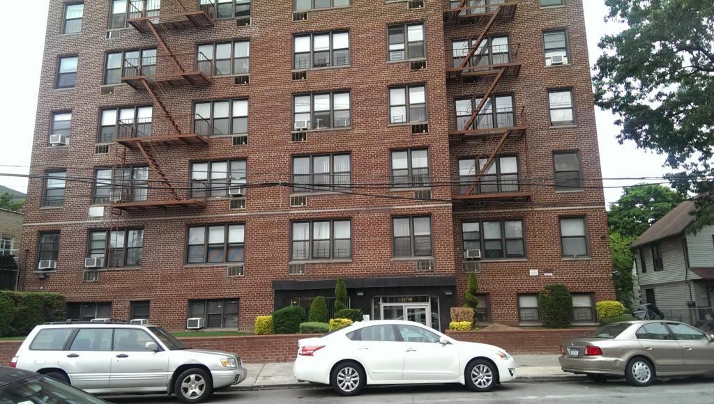 1075 Sheepshead Bay Road, Unit 7R Brooklyn, NY 11229 - Photo 1 of 1 a front view of a residential apartment building with a parking space