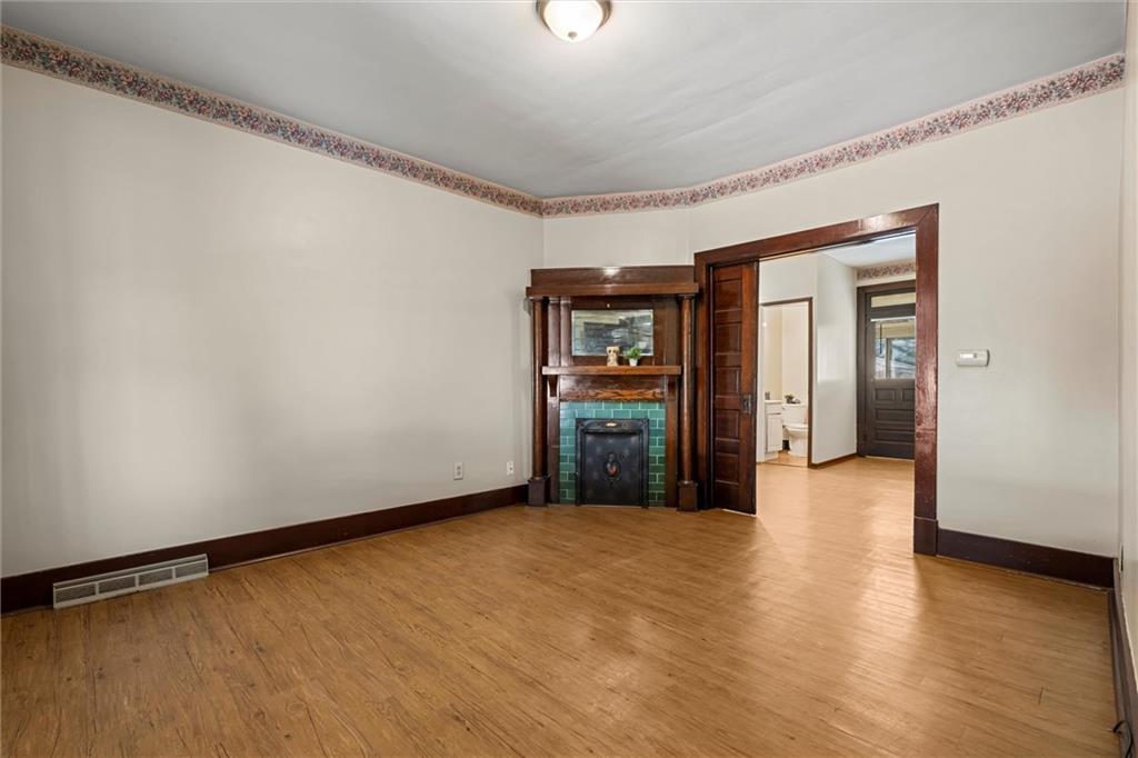 325 Walnut Street Vandergrift, PA 15690 - Photo 5 of 29 Spacious Living Room with a Gorgeous Decorative Fireplace.