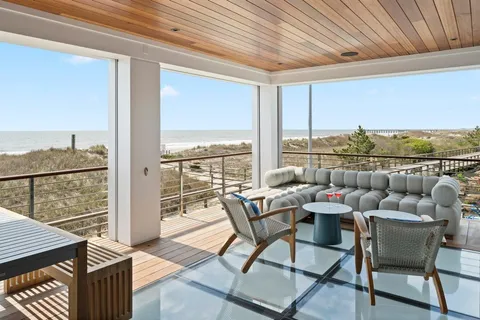 a dining room with furniture and outdoor space