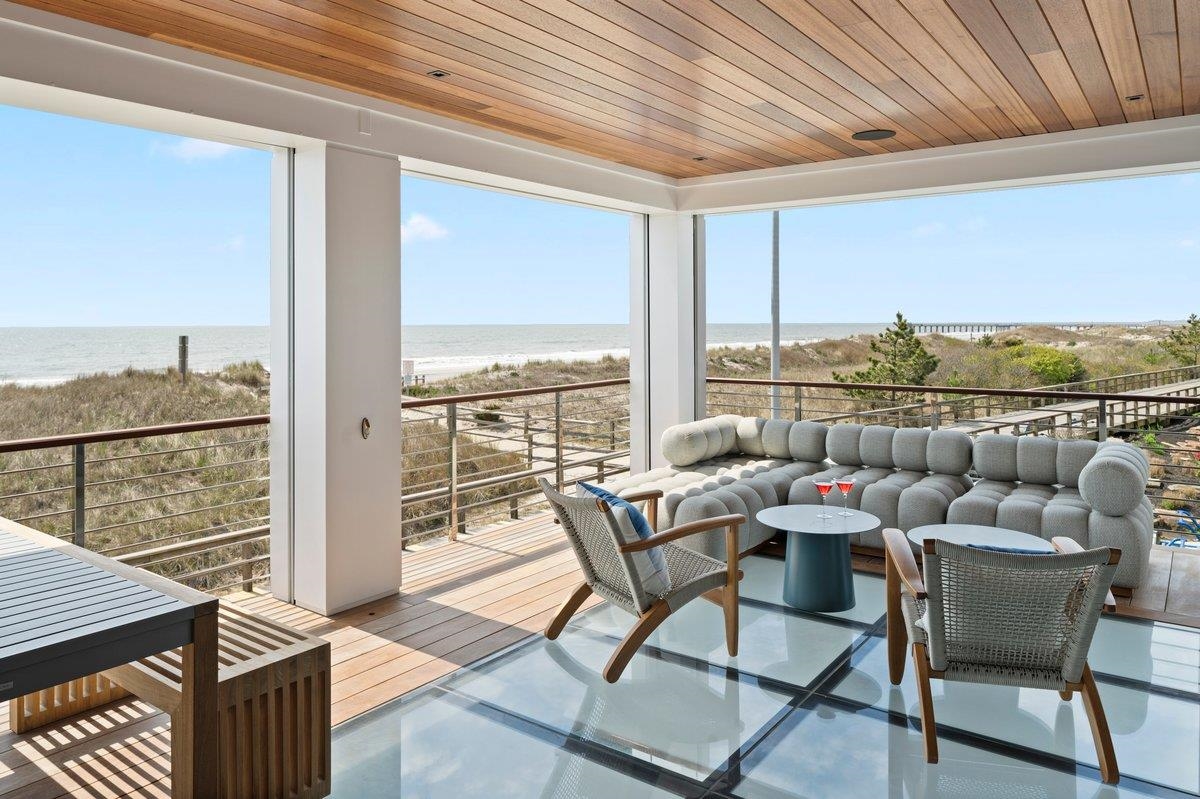 83 25th Street East Avalon, NJ 08202 - Photo 12 of 47 a dining room with furniture and outdoor space