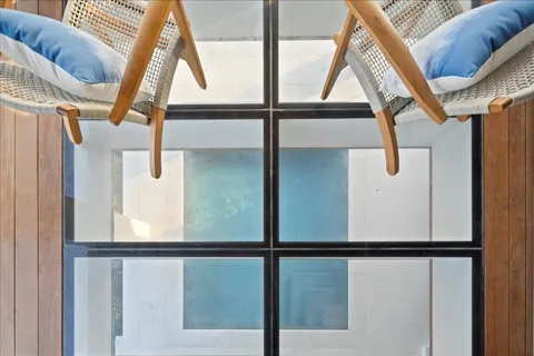 a view of with a large window with a hallway